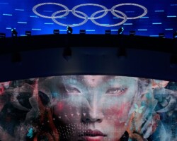 The Olympic rings are illuminated during a performance at the closing ceremony of the 2026 Winter Olympics, in Verona, Italy, Sunday, Feb. 22, 2026. (AP Photo/Natacha Pisarenko)