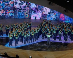 Olympic volunteers during the closing ceremony of the 2026 Winter Olympics, in Verona, Italy, Sunday, Feb. 22, 2026. (AP Photo/Ashley Landis)