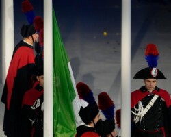 Carabinieri raise the Italian flag during the closing ceremony of the 2026 Winter Olympics, in Verona, Italy, Sunday, Feb. 22, 2026. (AP Photo/Ashley Landis)