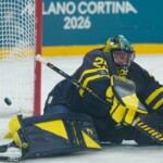 Sweden's goalkeeper Jacob Markstrom fails to saves as Slovakia's Martin Gernat scores his side's second goal during a preliminary round match of men's ice hockey between Sweden and Slovakia at the 2026 Winter Olympics, in Milan, Italy, Saturday, Feb. 14, 2026. (AP Photo/Petr David Josek)